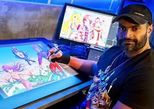 Germain Kaniza dessinant sur une tablette Wacom